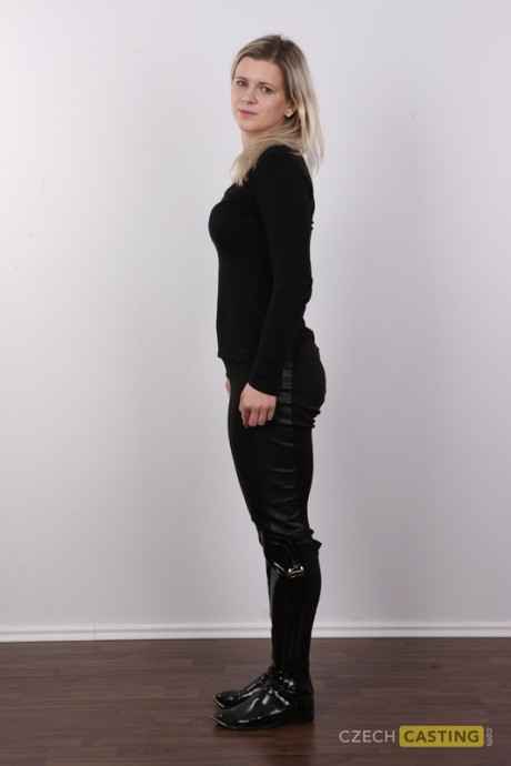 Naughty blondy Ester stands straight and narrow before her first nude appearance