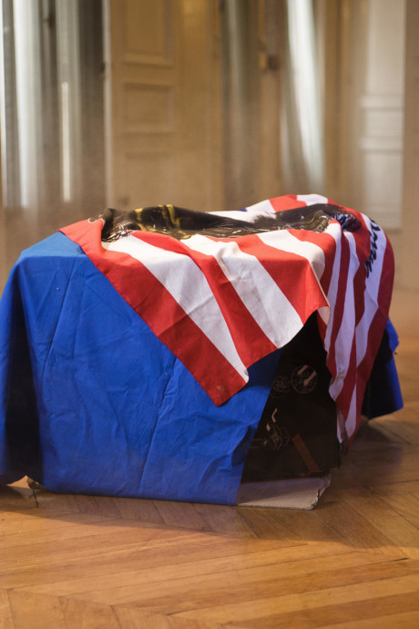 Sleazy maid Leonda A exposes her small nips and bushy beaver in a solo