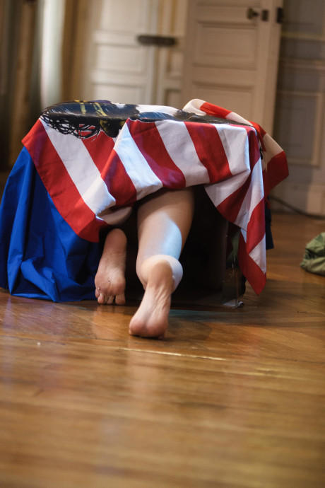 Sleazy maid Leonda A exposes her small nips and bushy beaver in a solo