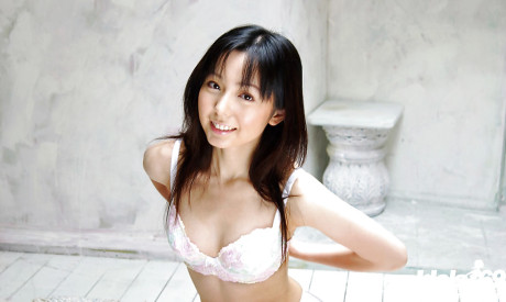 Foxy chinese babe Yui Hasumi stripping off her undergarment on the bed
