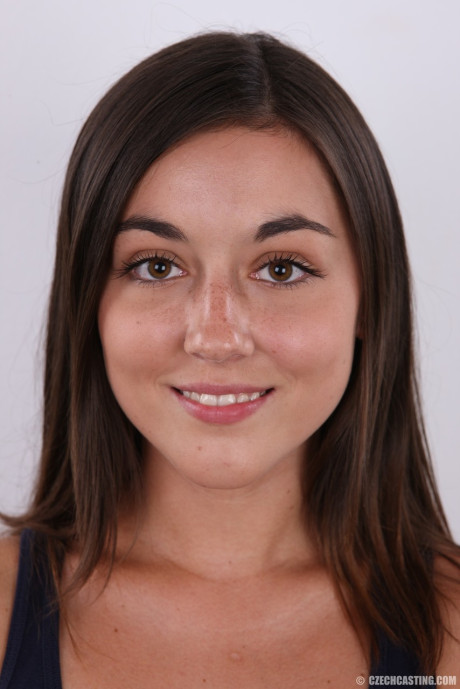 Cute teen stands nude after removing her clothes and underthings