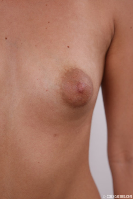 Cute teen stands nude after removing her clothes and underthings