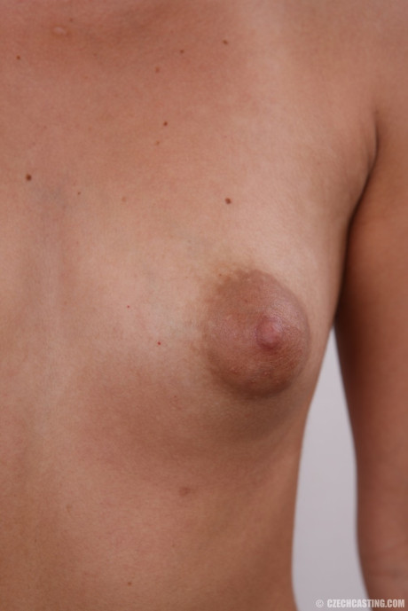 Cute teen stands nude after removing her clothes and underthings