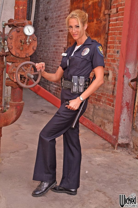 Charming police officer Jessica Drake shows her fakes and poses in a solo