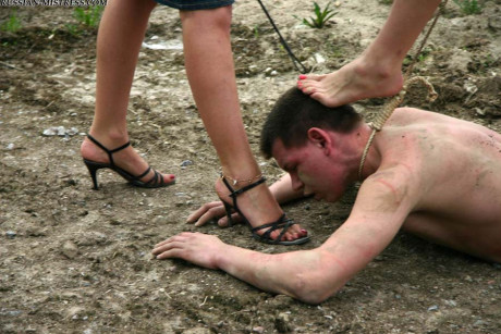 Cruel women trample and piss a submissive man man stud during outdoor CFNM play