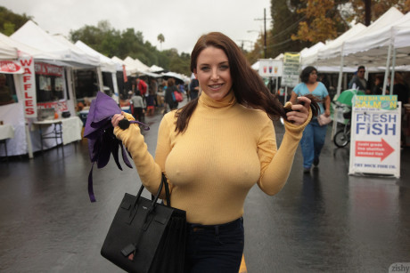 Curvaceous babe Angela White strips her bra and teases with her nips in public