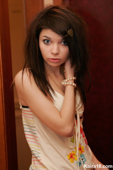 Tiny teen Kaira 18 scrunches up her face during a non undressed shoot in a bathroom