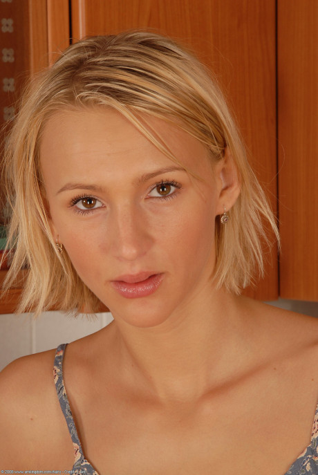 Petite blondie Petty shows her bushy vagina up close in lovely cuisine solo