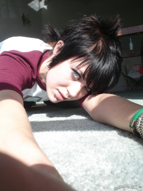 Short-haired punk bitch chick with pierced nose, lip, navel in her own photos