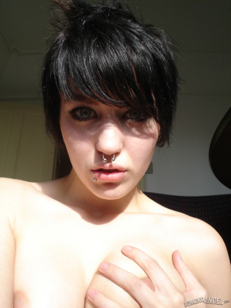 Short-haired punk bitch chick with pierced nose, lip, navel in her own photos