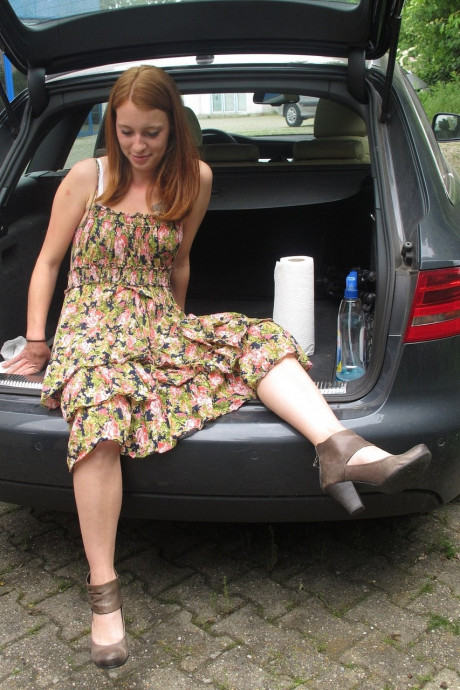 Redheaded German Meine Fotze strips and masturbates in the car in public