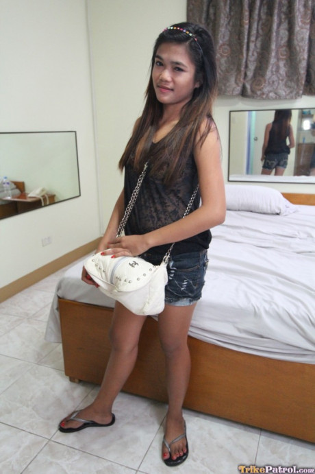 Brunette Filipina Mildred strips and shows off her bushy twat