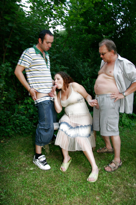 Curly-haired pregnant bitch gets boned by four horny lads outdoor