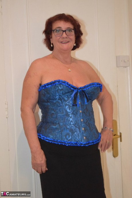 Overweight grandma Phillipas sluts undoes her bustier during solo action
