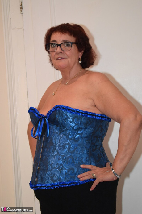 Overweight grandma Phillipas sluts undoes her bustier during solo action