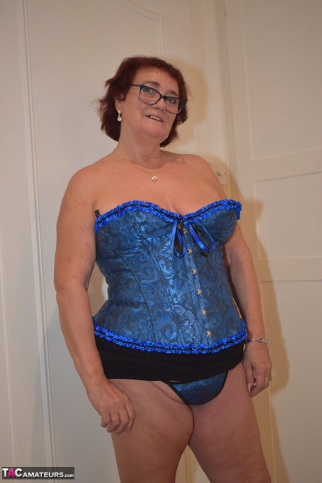 Overweight grandma Phillipas sluts undoes her bustier during solo action