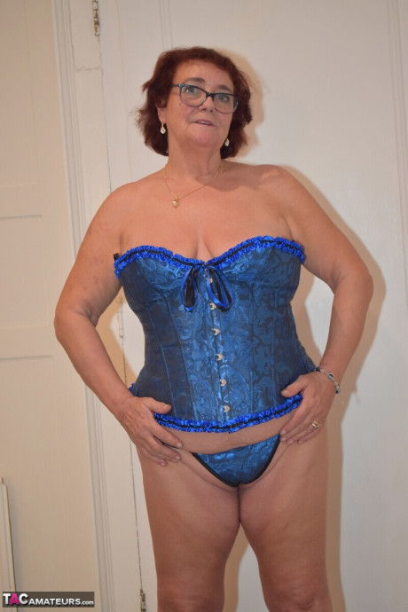 Overweight grandma Phillipas sluts undoes her bustier during solo action