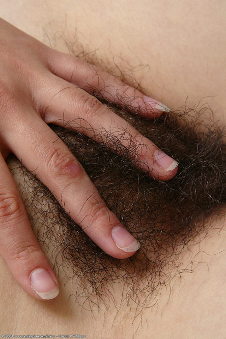 Amateur broad Lin pulls down her white panties to expose hairy bush
