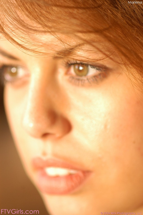 Dark-haired babe Marlena loses her panties and rides herself with a heel