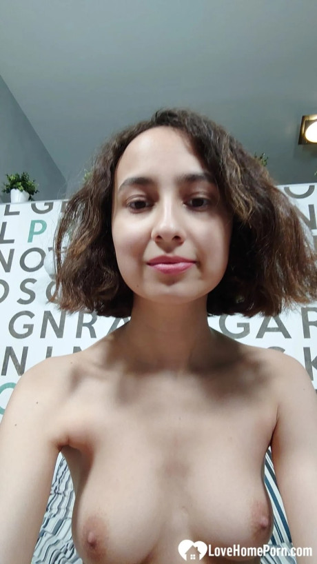 Pretty amateur showing off her great natural boobs in a solo