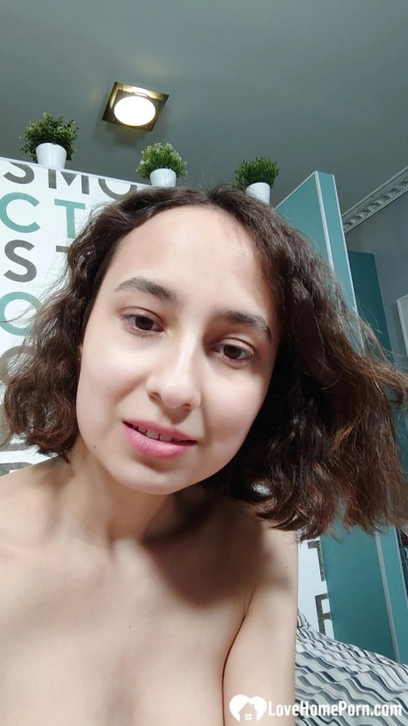 Pretty amateur showing off her great natural boobs in a solo