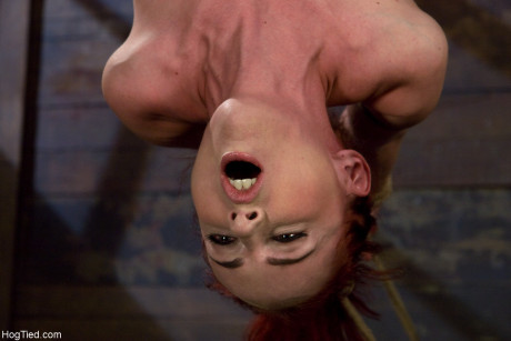 Busty MILF Mz Berlin gets tortured while hanging from the ceiling upside down