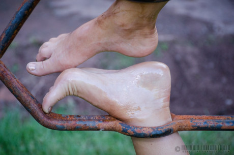 Female slave London River is restrained in a variety of ways in a yard