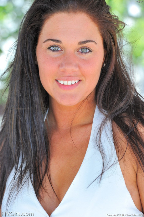 Green-eyed beauty Harper strips at the parking lot and poses undressed