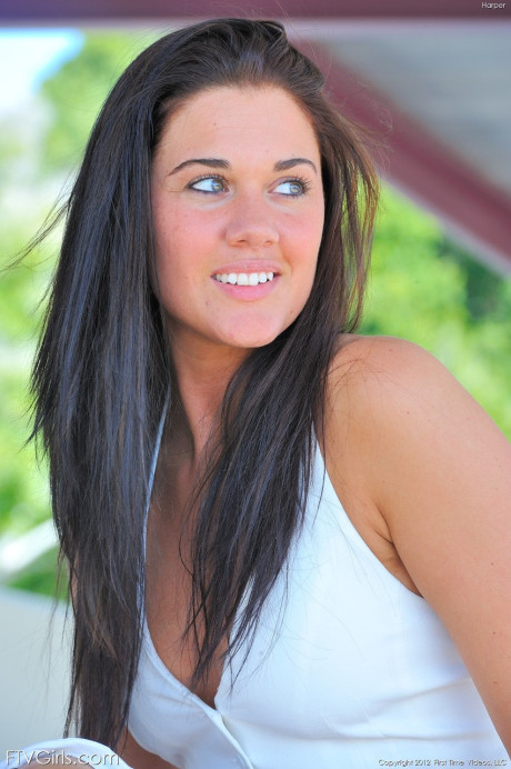 Green-eyed beauty Harper strips at the parking lot and poses undressed