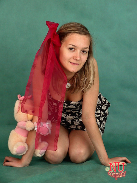 Fine amateur teenie Marina strips & masturbates while posing with a stuffed toy