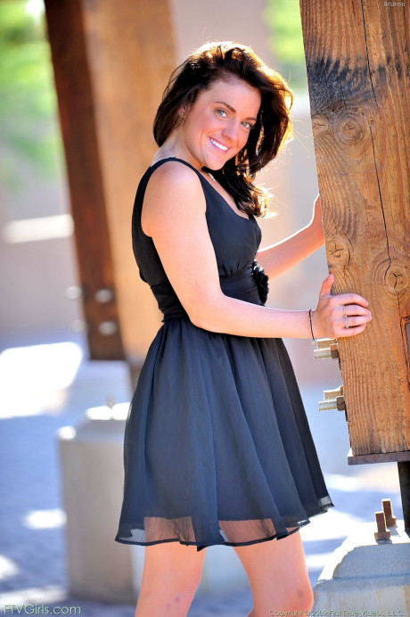 Adorable girl Brianne undresses and teases with her delicious snatch