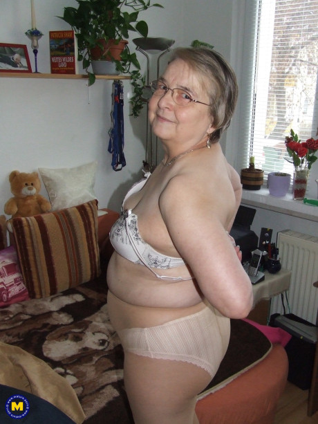 Meaty European old lady Sybille stripping off her clothes and skin tone tights