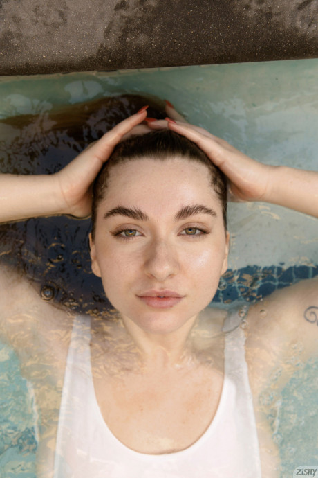 Fine amateur babe in a hot swimsuit Olivia Yukon goes for a swim