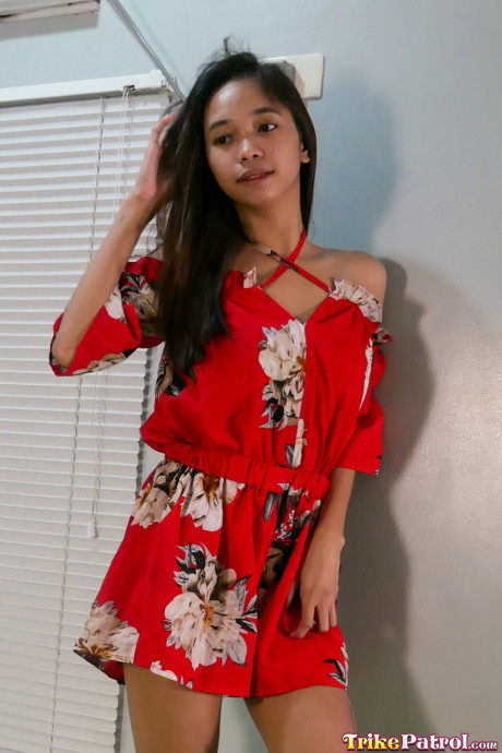 Pretty oriental teen Lexi Barrera doffs her clothes and poses behind undressed