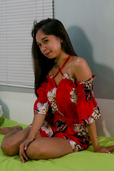 Pretty oriental teen Lexi Barrera doffs her clothes and poses behind undressed