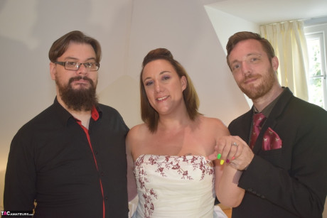 Amateur lady Sara Banks as her tits and cunt freed from a gown by two men