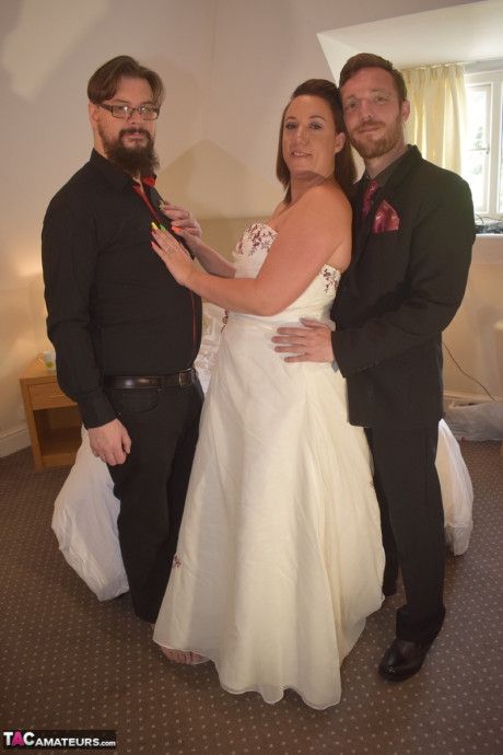 Amateur lady Sara Banks as her tits and cunt freed from a gown by two men