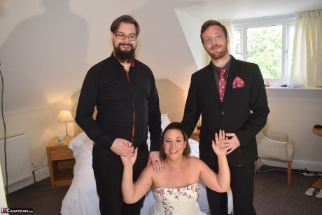 Amateur lady Sara Banks as her tits and cunt freed from a gown by two men