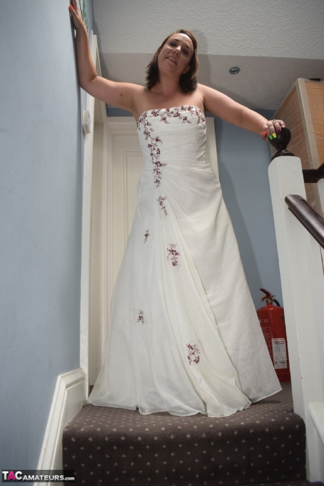 Amateur lady Sara Banks as her tits and cunt freed from a gown by two men