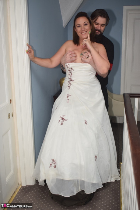 Amateur lady Sara Banks as her tits and cunt freed from a gown by two men