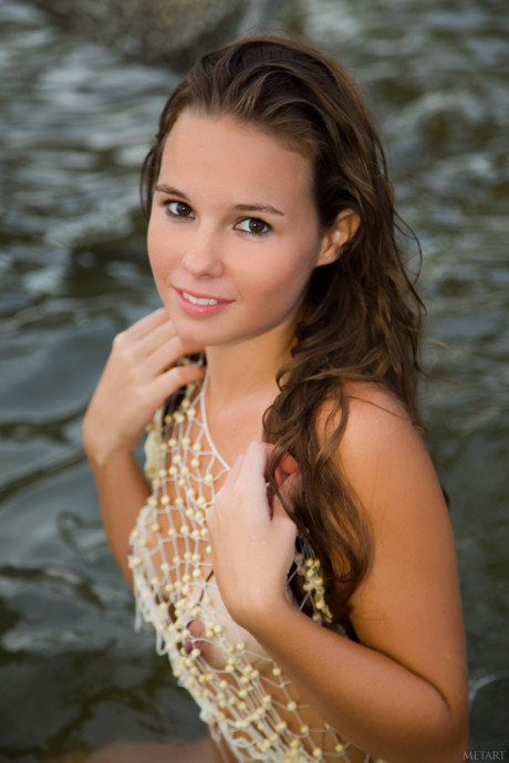 Glamorous young Aria A displays her hot body with tan lines on the beach