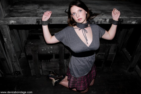 Barely legal Brazilian sub Sara Scott posing bound in the dungeon
