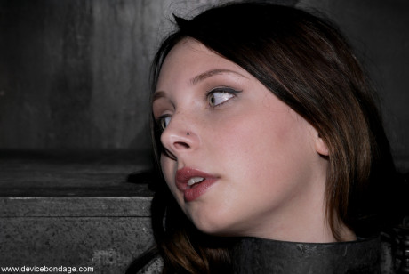 Barely legal Brazilian sub Sara Scott posing bound in the dungeon