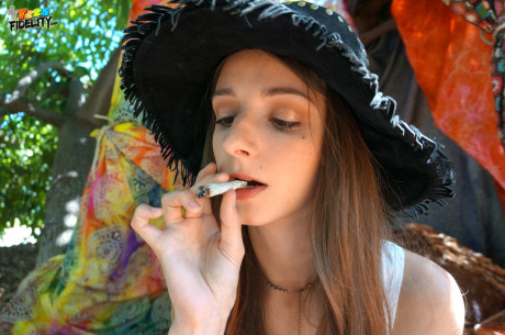 Hippy whore lady Willow Hayes bares her titties before smoking weed in the outdoors