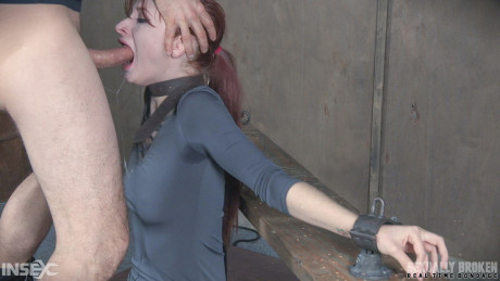 Pale redhead Violet Monroe undergoes a rough throat fucking in cell