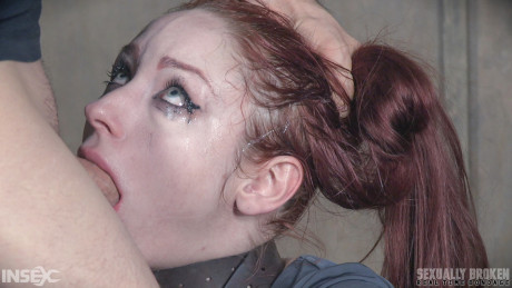 Pale redhead Violet Monroe undergoes a rough throat fucking in cell