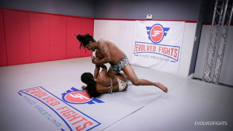 Ebony couple Paris Love & her friend get undressed while wrestling on a mat