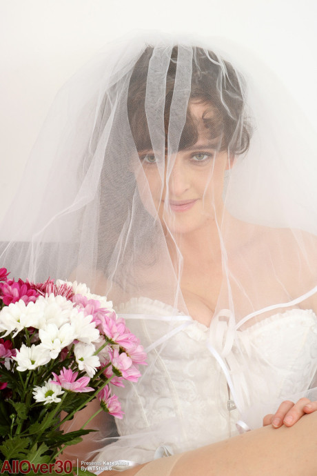 30 plus female Kate Anne shows her great breasts in a bridal veil and heels