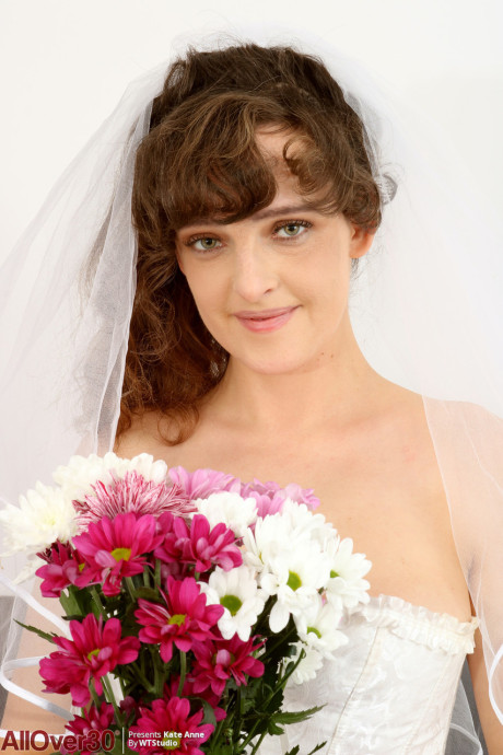30 plus female Kate Anne shows her great breasts in a bridal veil and heels