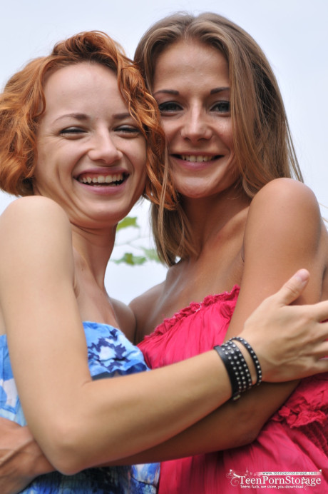 Fresh teenie lesbians Nastya & Foxy gets nude on blanket in a field